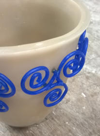 Cup with hand made design.